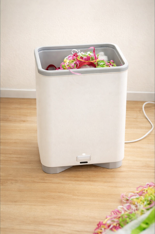 Forget Bending: This Touchless Vacuum Bin Does the Dirty Work for You (Literally)